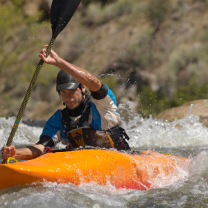 Man in Orange River Runner Kayak